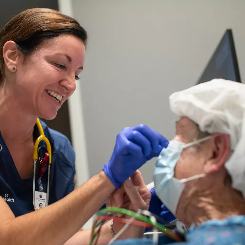 Nurse Helping Patient With Mask